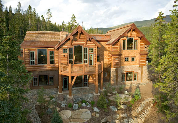 Looks like a full log house but is actually a hybrid log house with log siding