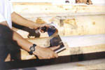 hand peeling with a drawknife