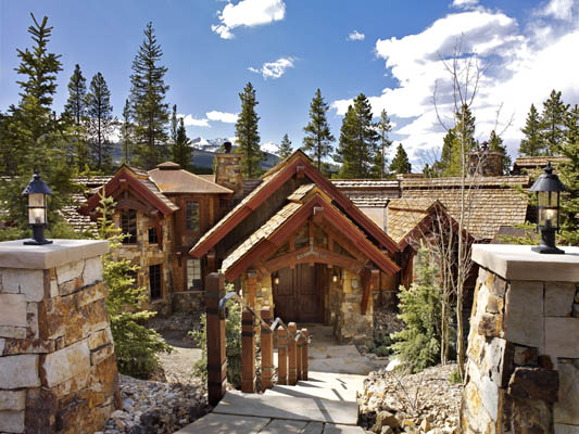 Timber frame home with square timber posts and hand-forged steel bands
